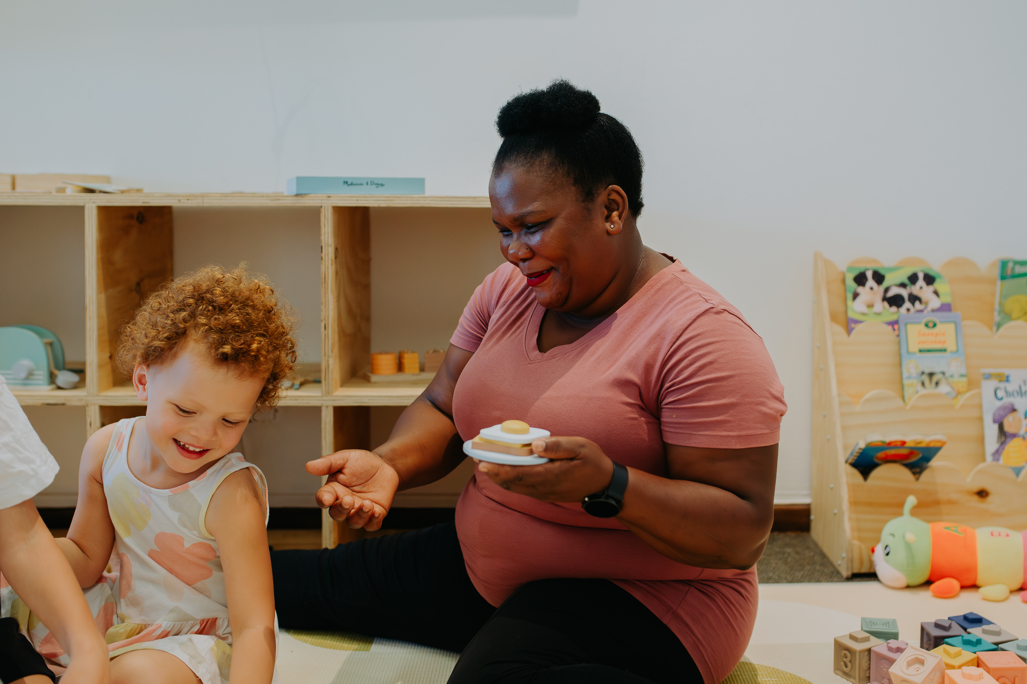 Read.Work.Play nanny caring for a child